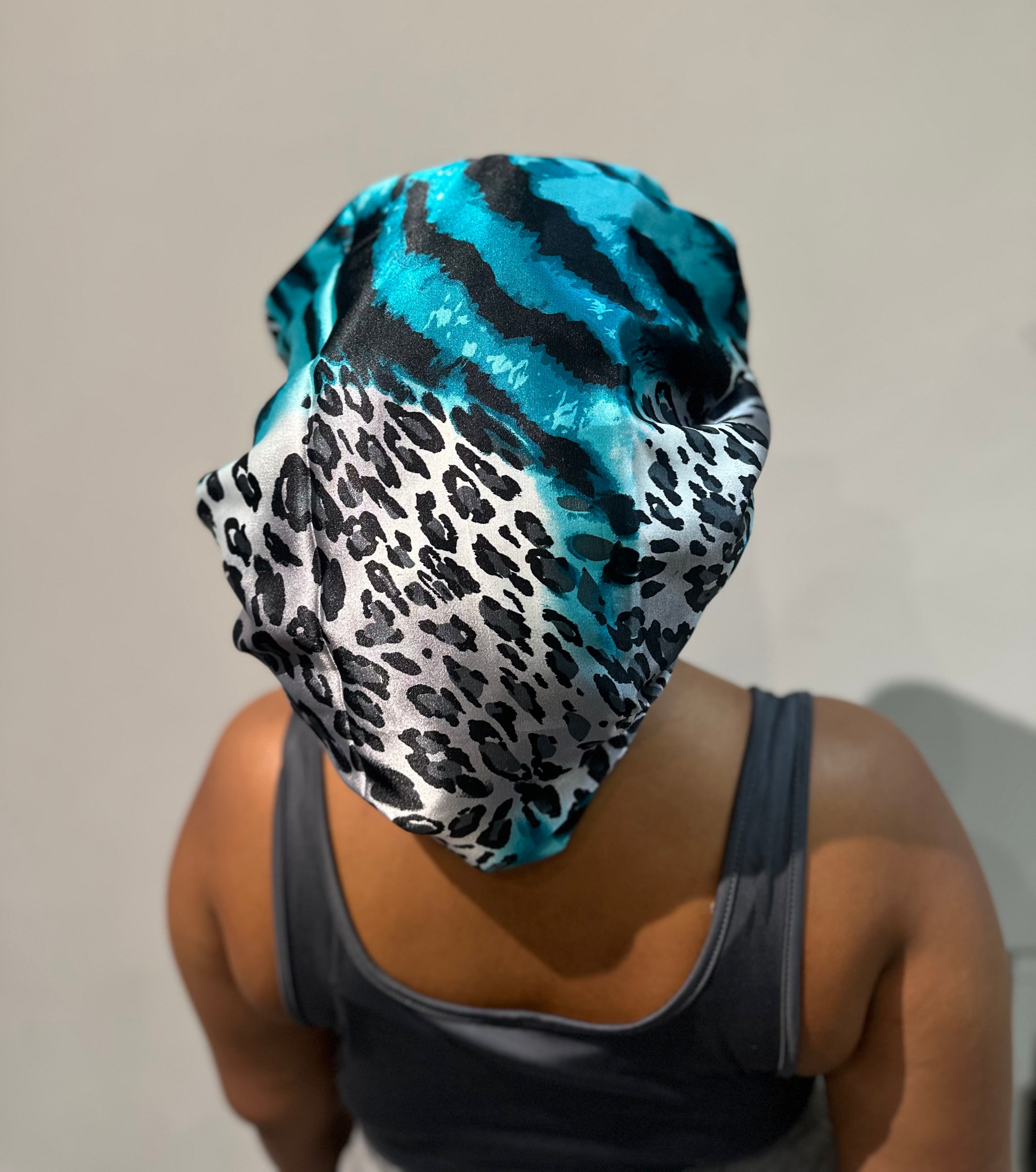 The mimi silky bonnet in blue black animal print