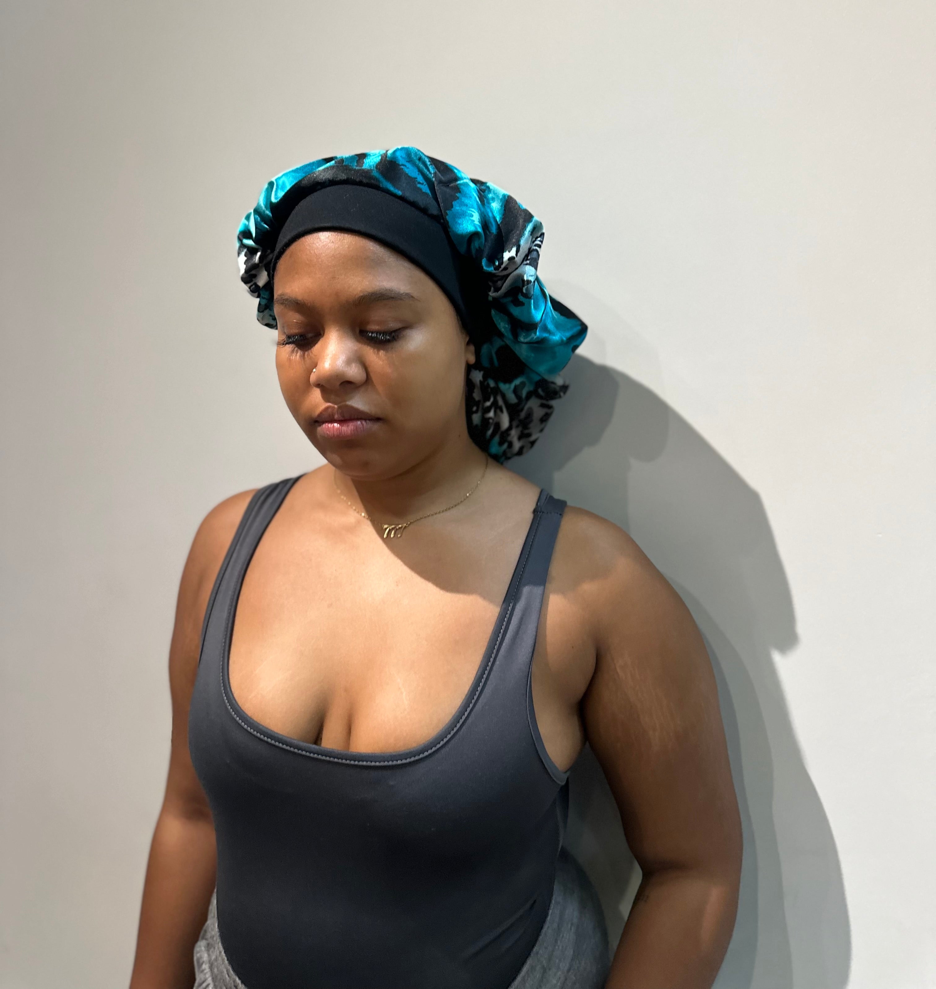 The mimi silky bonnet in blue black animal print